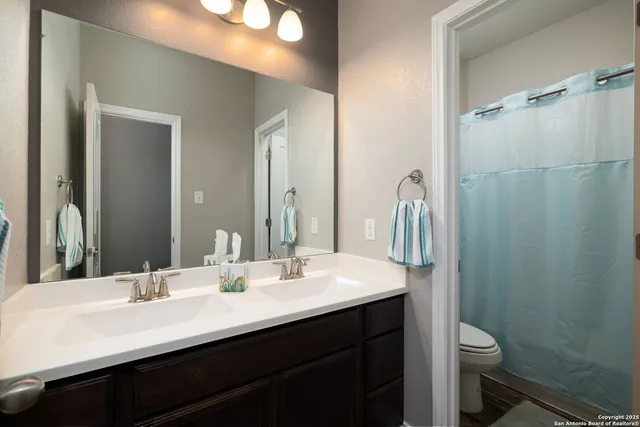 a view of a porch with a door and wooden floor