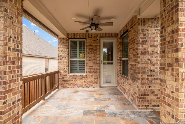 a view of a deck with furniture and a yard