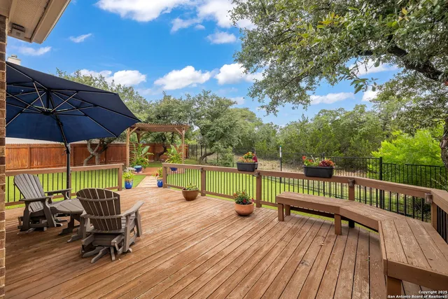 a view of a patio on the deck in the backyard