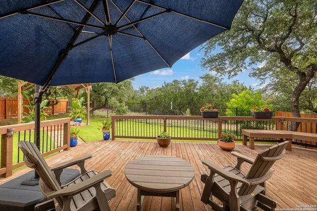 a view of a patio with couches and potted plants