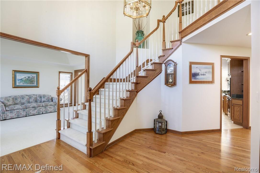 4140 Ridge Side Drive Rochester, MI 48306 - Photo 7 of 42 Extra wide staircases to the upper level in the extra large foyer.