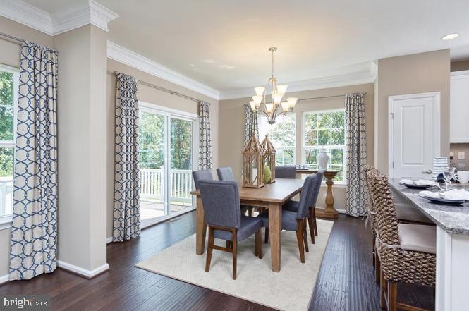 313 Piper Lane Exton, PA 19341 - Photo 3 of 7 a view of a dining room with furniture window and wooden floor