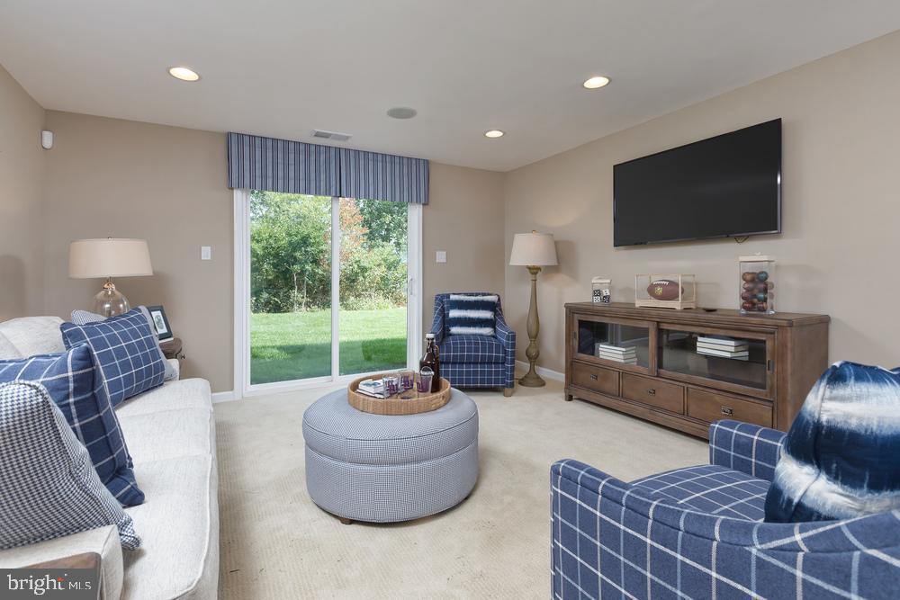 313 Piper Lane Exton, PA 19341 - Photo 4 of 7 a living room with furniture and a flat screen tv