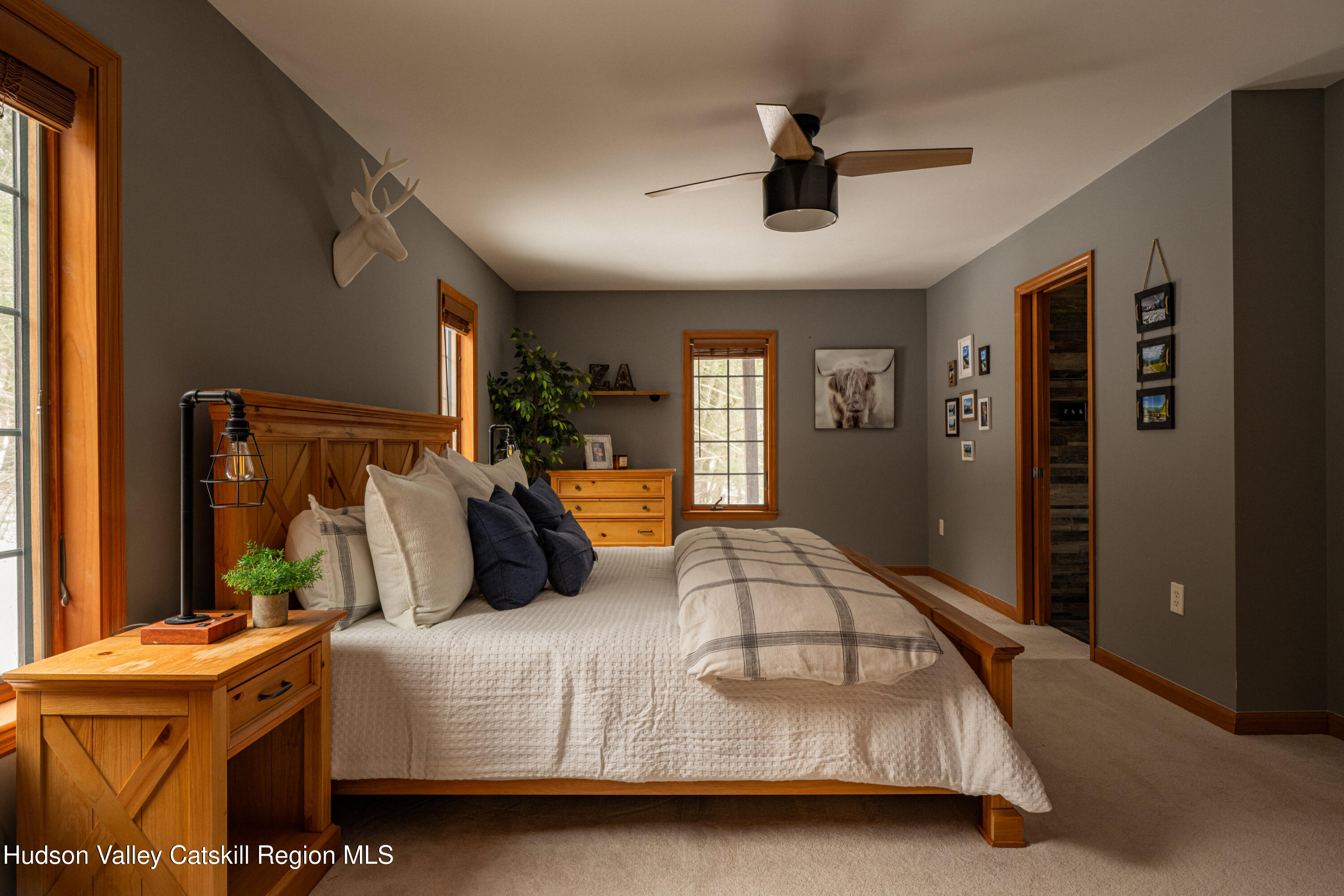 37 Notch View Road Lexington, NY 12468 - Photo 29 of 71 a bedroom with a bed and a chandelier
