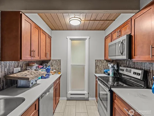 a kitchen that has a sink and a stove