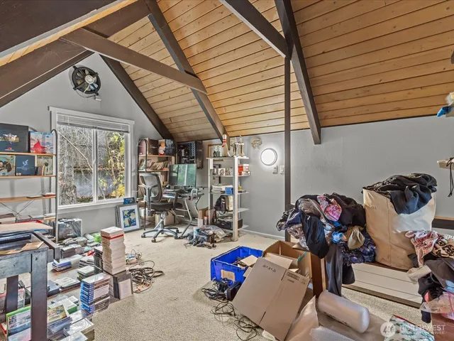 a bedroom with furniture and a flat screen tv