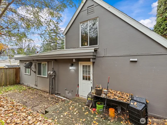 a view of a lake with a wooden fence