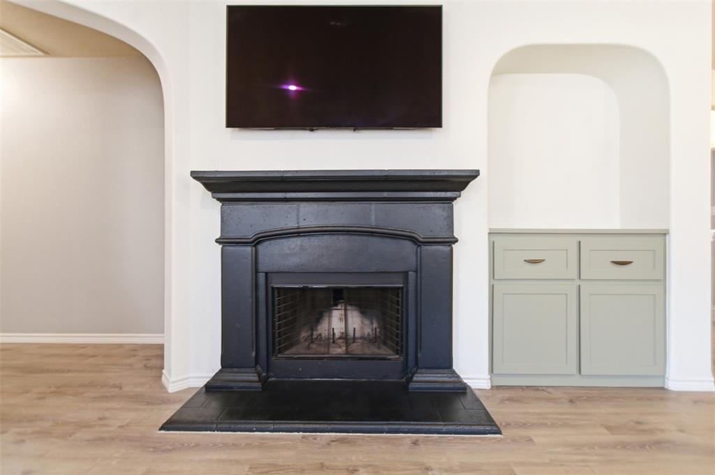 10928 Middleglen Road Fort Worth, TX 76052 - Photo 15 of 37 a living room with a fireplace