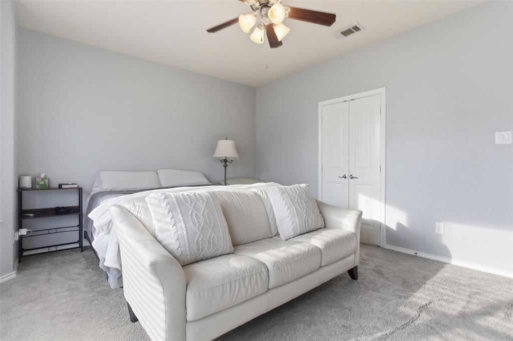 10928 Middleglen Road Fort Worth, TX 76052 - Photo 18 of 37 a living room with furniture and a chandelier