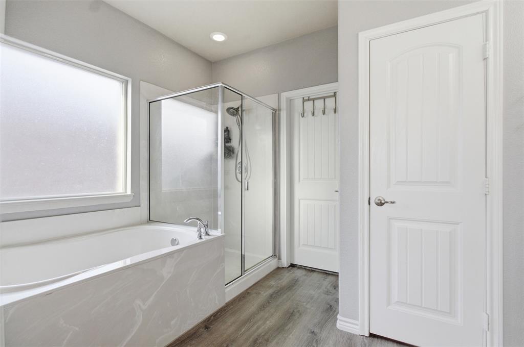 10928 Middleglen Road Fort Worth, TX 76052 - Photo 19 of 37 a bathroom with a bathtub and a shower