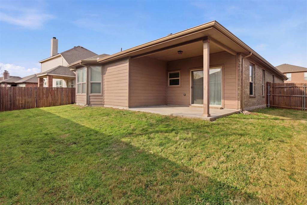 10928 Middleglen Road Fort Worth, TX 76052 - Photo 6 of 37 a front view of a house with garden