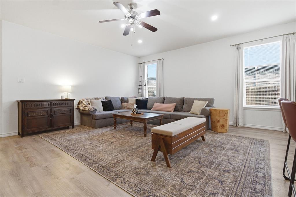 10928 Middleglen Road Fort Worth, TX 76052 - Photo 10 of 37 a living room with furniture and a chandelier