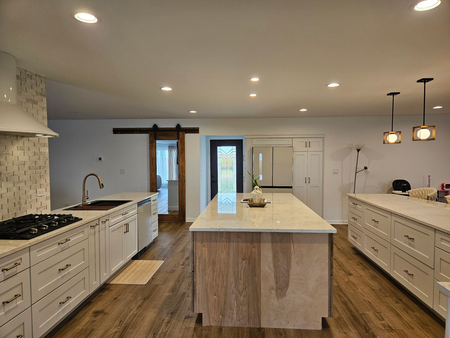 34769 Zilm Road Wilmington, IL 60481 - Photo 25 of 30 a large kitchen with kitchen island a sink stainless steel appliances and a counter top space
