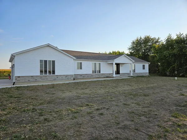 a house with trees in the background