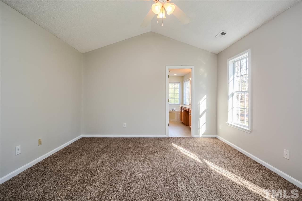 8413 Ridgebury Road Raleigh, NC 27603 - Photo 12 of 18 an empty room with windows