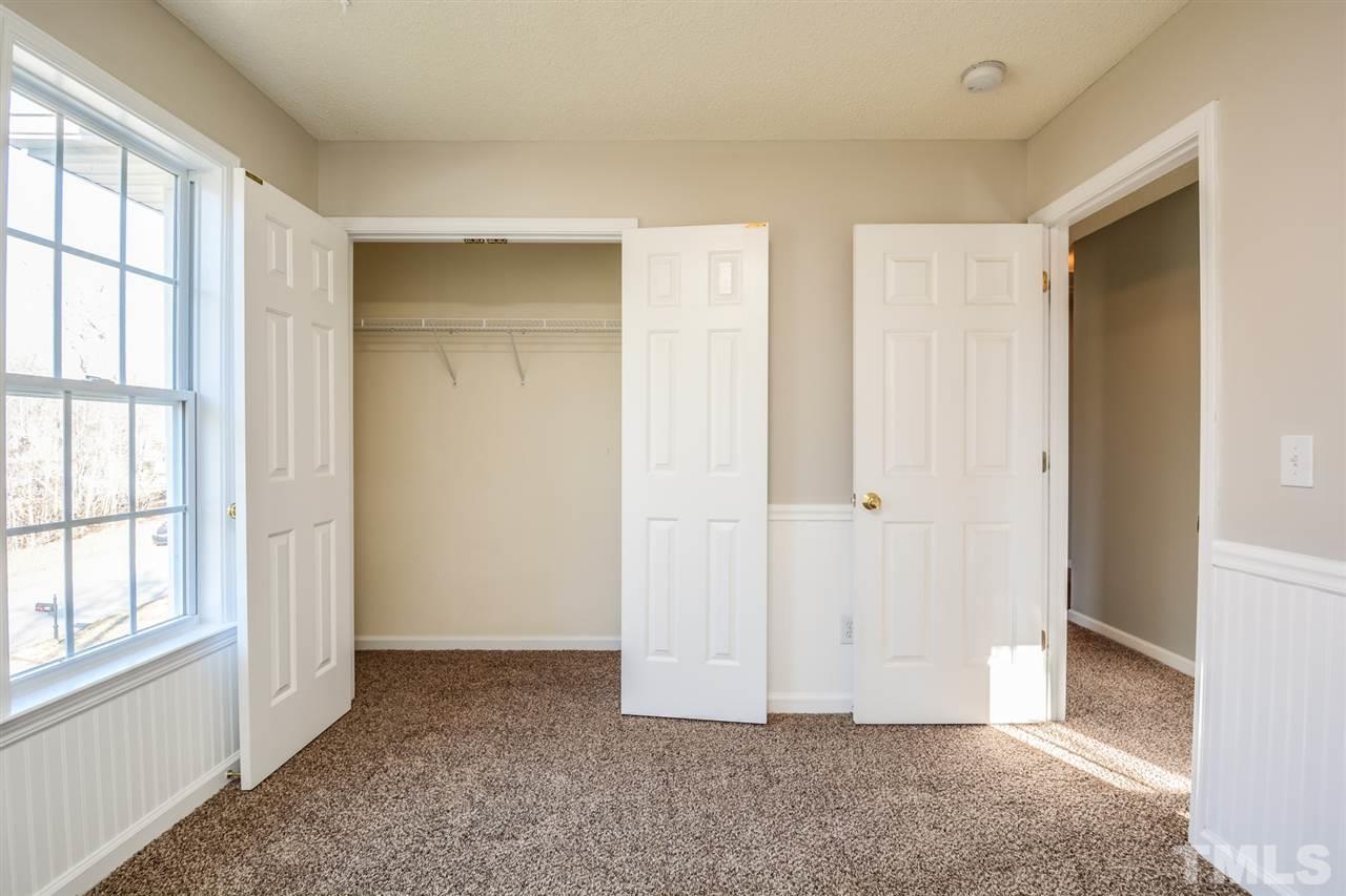 8413 Ridgebury Road Raleigh, NC 27603 - Photo 14 of 18 an empty room with windows and closet