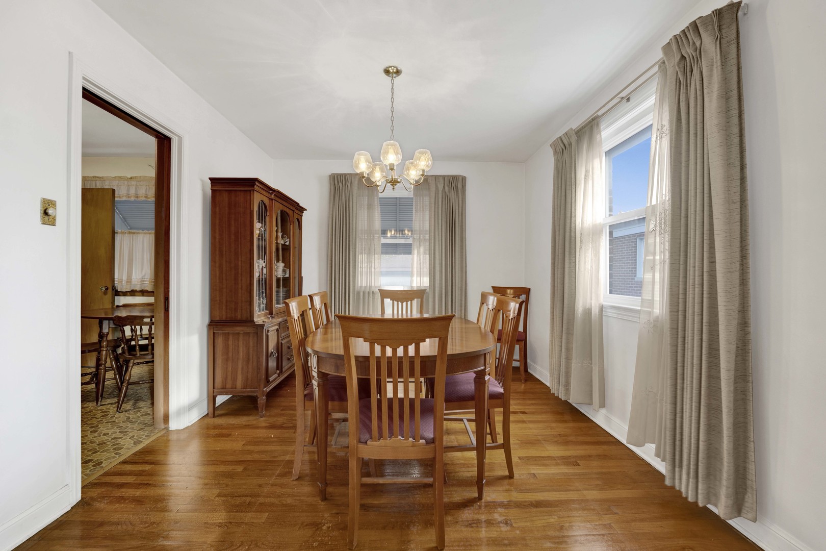 2223 South 7th Avenue North Riverside, IL 60546 - Photo 6 of 20 a view of a dining room with furniture window and wooden floor