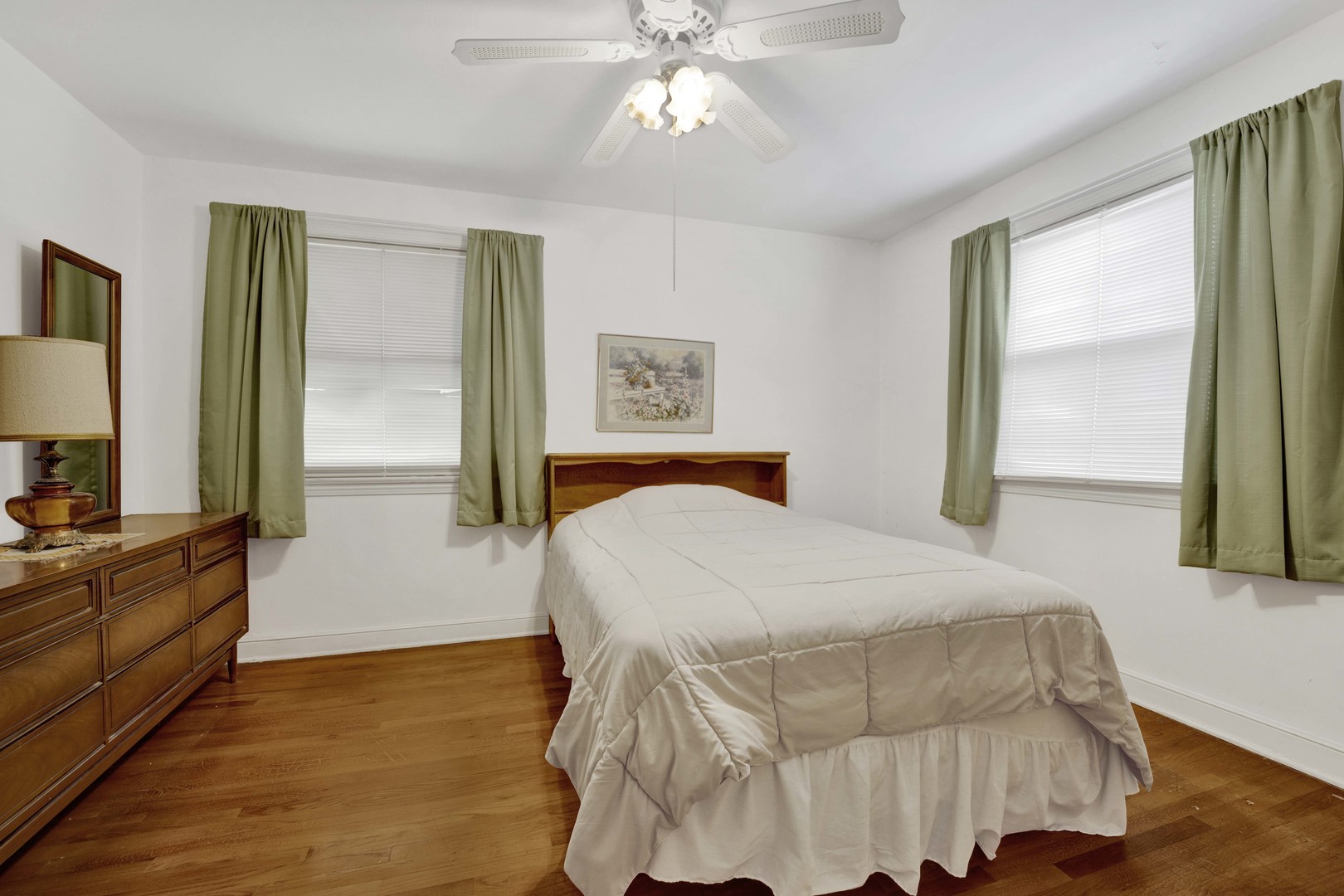 2223 South 7th Avenue North Riverside, IL 60546 - Photo 9 of 20 a bedroom with a bed and a flat tv screen on dresser