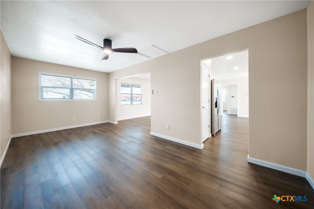 1200 Stephen Street Killeen, TX 76549 - Photo 11 of 22 a view of an empty room with wooden floor and a window