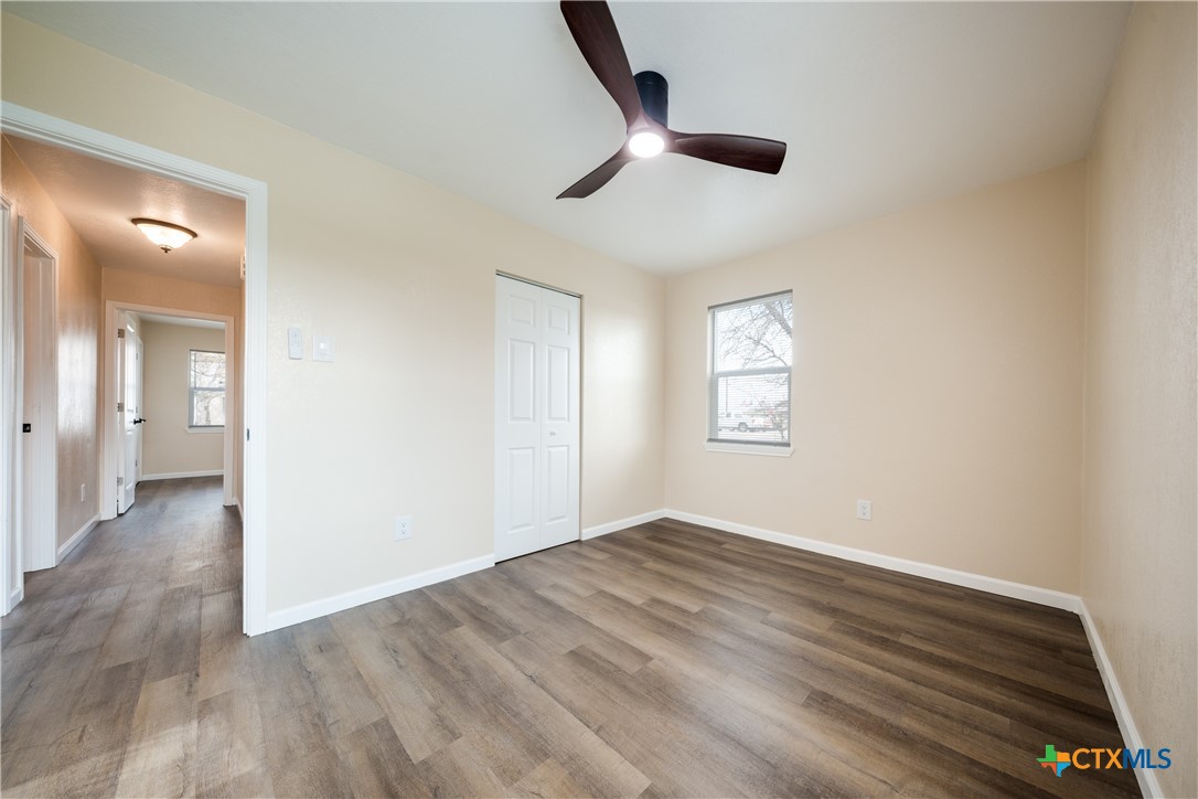 1200 Stephen Street Killeen, TX 76549 - Photo 17 of 22 wooden floor in an empty room and a window