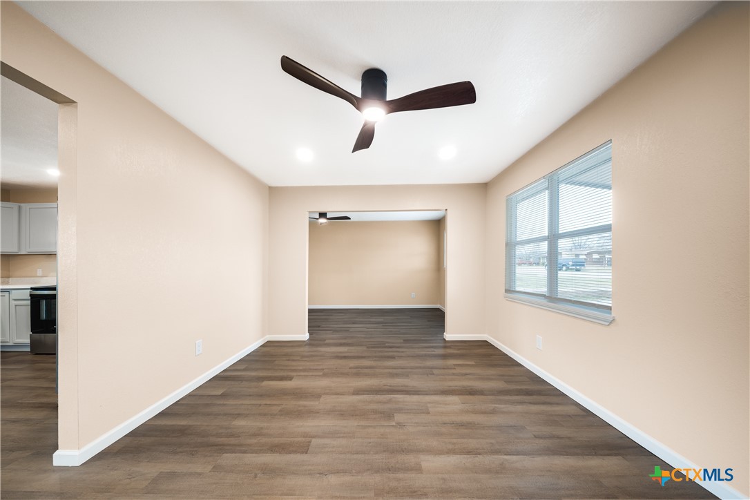 1200 Stephen Street Killeen, TX 76549 - Photo 9 of 22 a view of empty room with wooden floor and fan