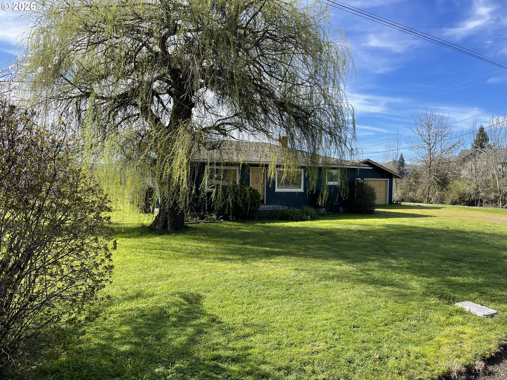 6404 Lookingglass Road Roseburg, OR 97471 - Photo 39 of 48 a view of a house with a yard