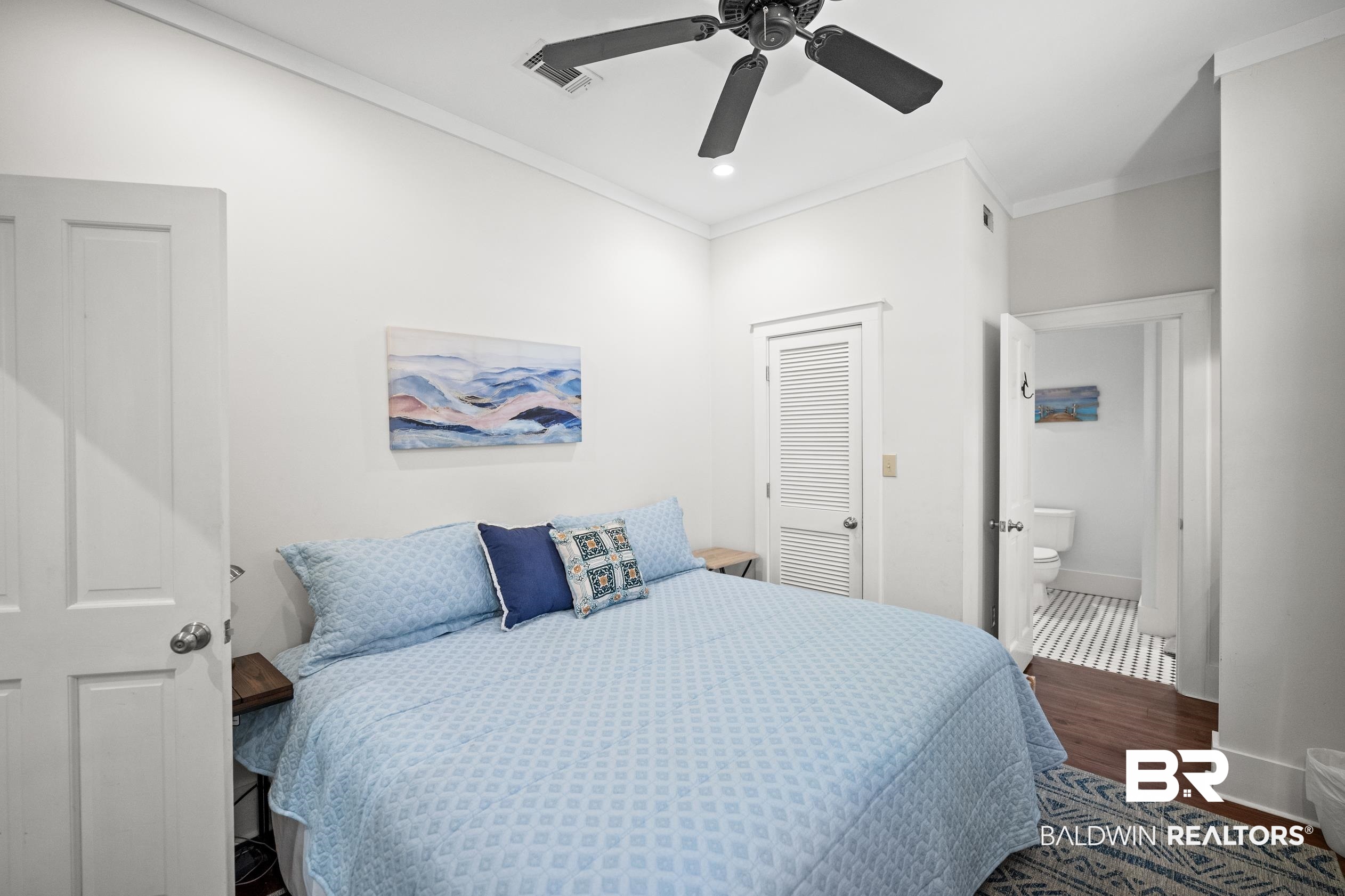 25773 Canal Road, Unit 28 Orange Beach, AL 36561 - Photo 27 of 48 Bedroom with dark wood-type flooring, crown molding, a closet, ceiling fan, and recessed lighting