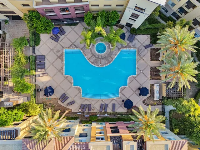 an aerial view of residential house with outdoor space and swimming pool