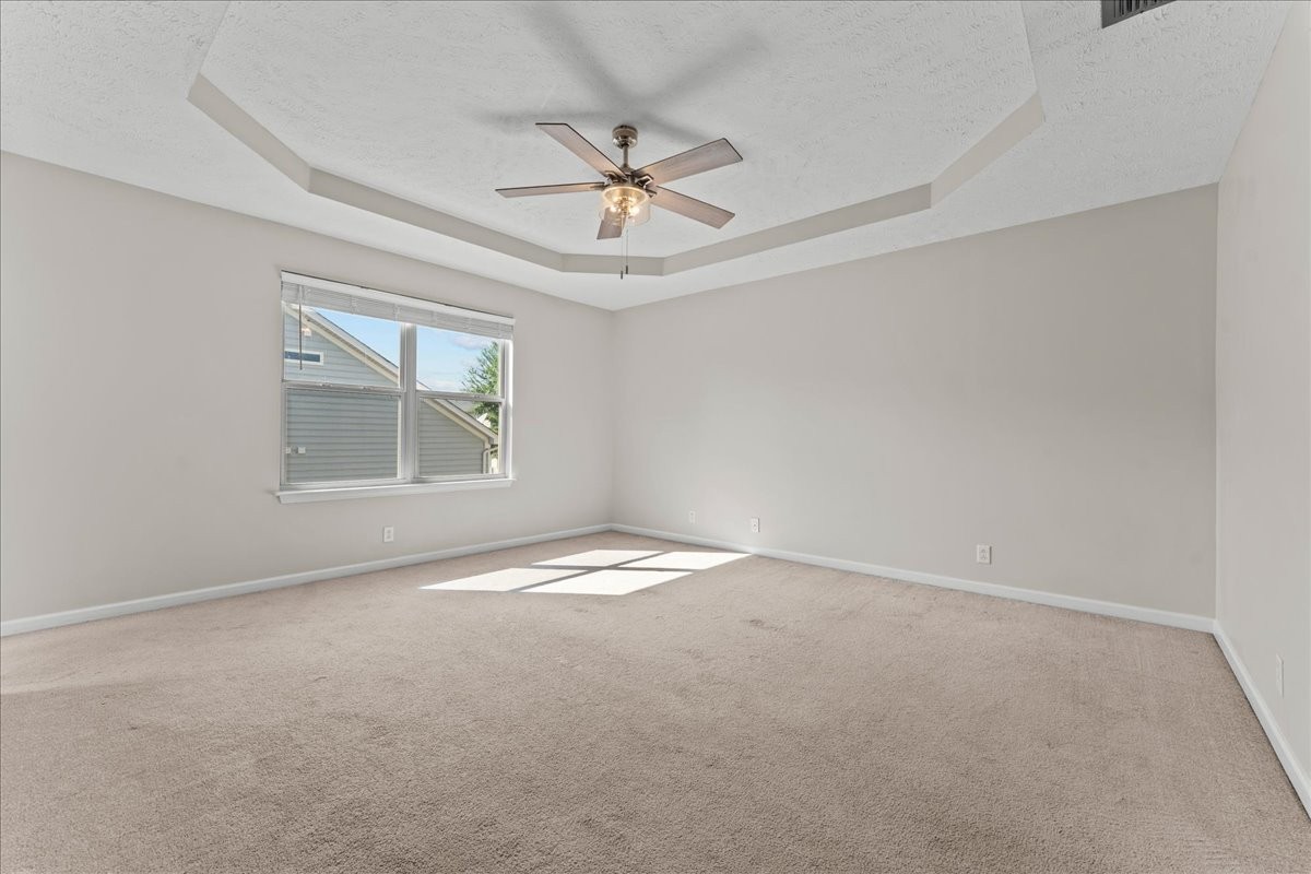 905 Thunder Gulch Way Murfreesboro, TN 37128 - Photo 17 of 27 an empty room with a window and a ceiling fan