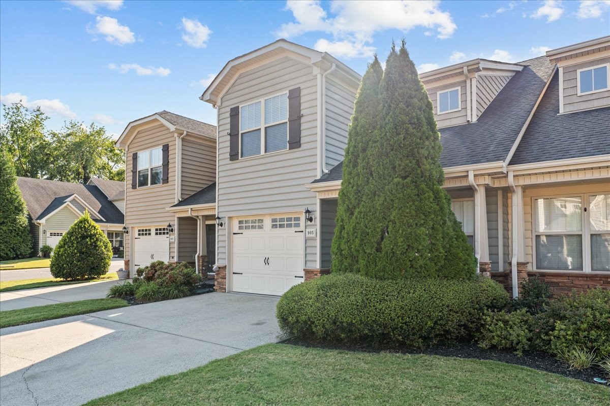 905 Thunder Gulch Way Murfreesboro, TN 37128 - Photo 4 of 27 a front view of a house with a garden