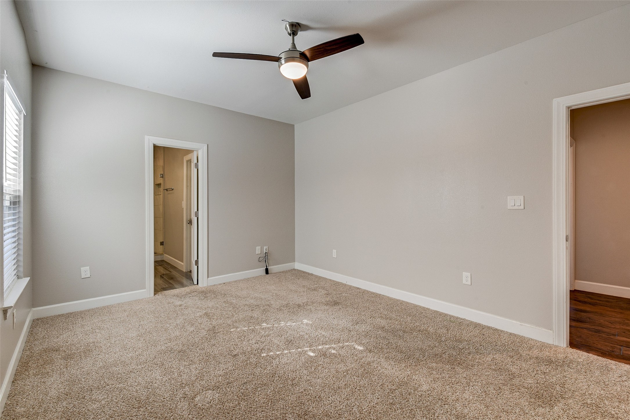 8617 Dosia Street Houston, TX 77051 - Photo 12 of 20 en empty room with ceiling fan and window