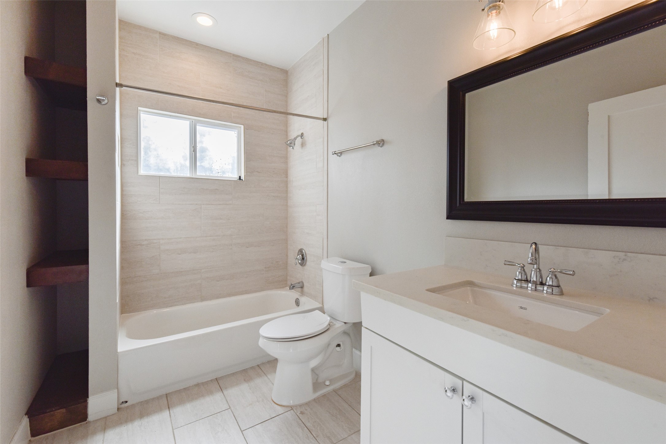 8617 Dosia Street Houston, TX 77051 - Photo 18 of 20 a bathroom with a sink a toilet and shower