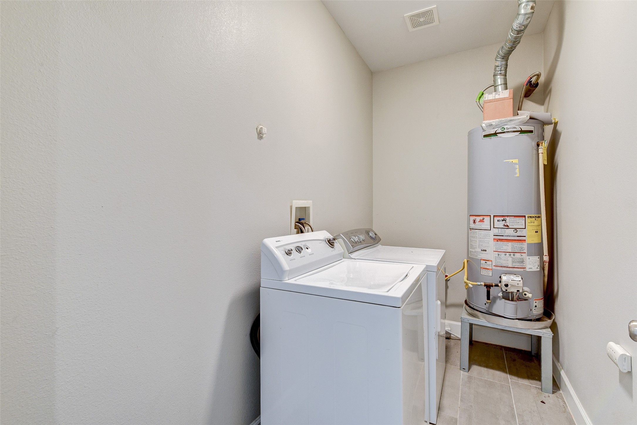 8617 Dosia Street Houston, TX 77051 - Photo 19 of 20 a utility room with dryer and washer