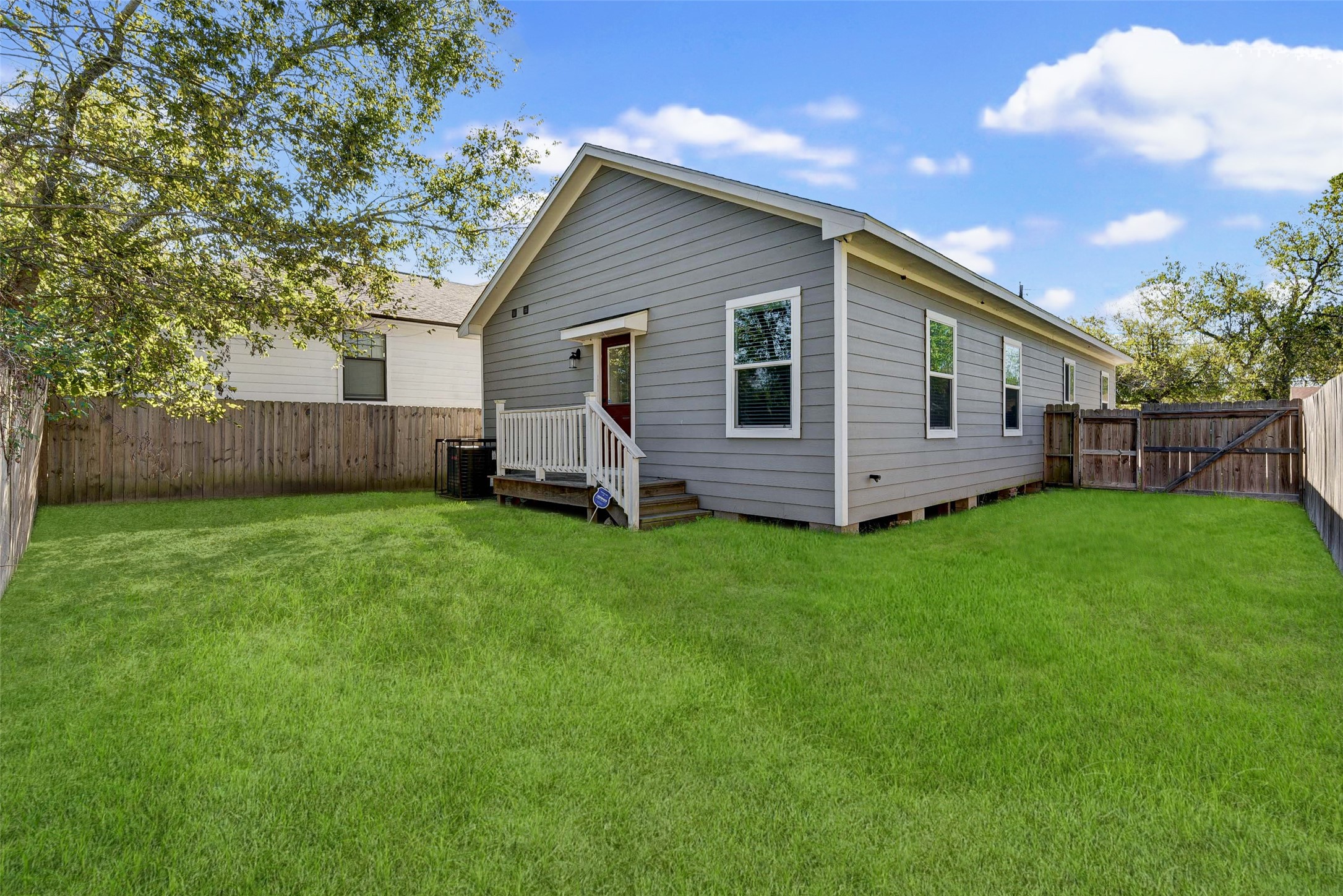 8617 Dosia Street Houston, TX 77051 - Photo 20 of 20 a view of a house with a yard and wooden fence