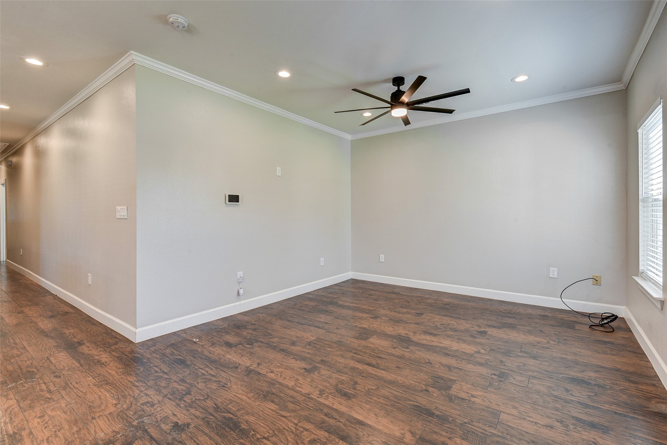 8617 Dosia Street Houston, TX 77051 - Photo 3 of 20 a view of an empty room with a ceiling fan