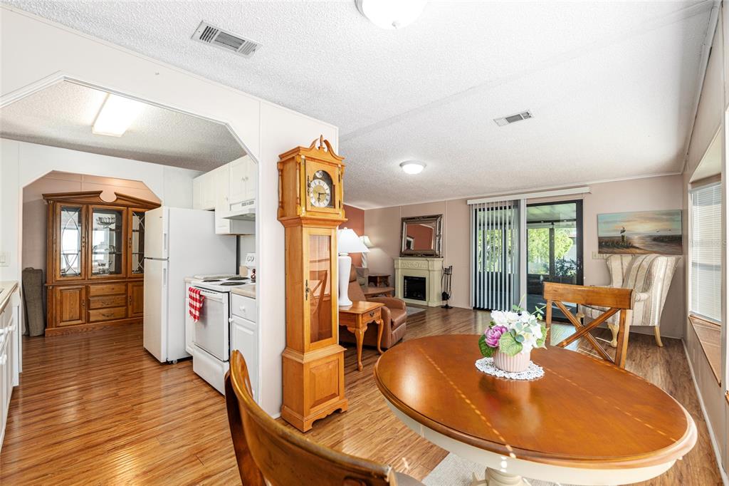 10085 Southeast 126th Place Belleview, FL 34420 - Photo 15 of 45 a dining room with wooden floor table and chairs