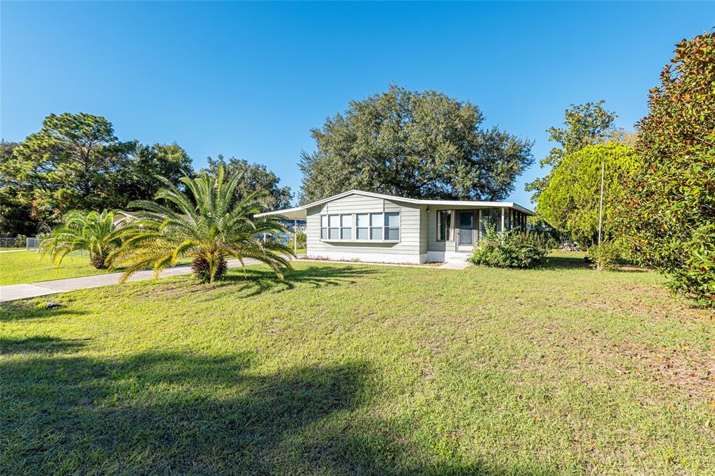 10085 Southeast 126th Place Belleview, FL 34420 - Photo 35 of 45 a house view with swimming pool in front of it