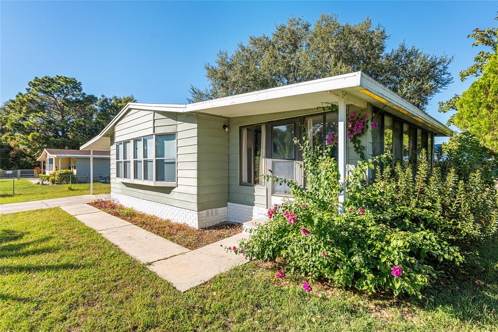 10085 Southeast 126th Place Belleview, FL 34420 - Photo 38 of 45 a front view of a house with a yard