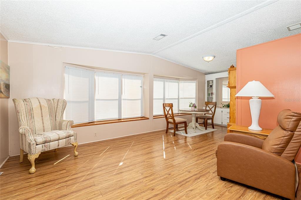 10085 Southeast 126th Place Belleview, FL 34420 - Photo 10 of 45 a living room with furniture and a table