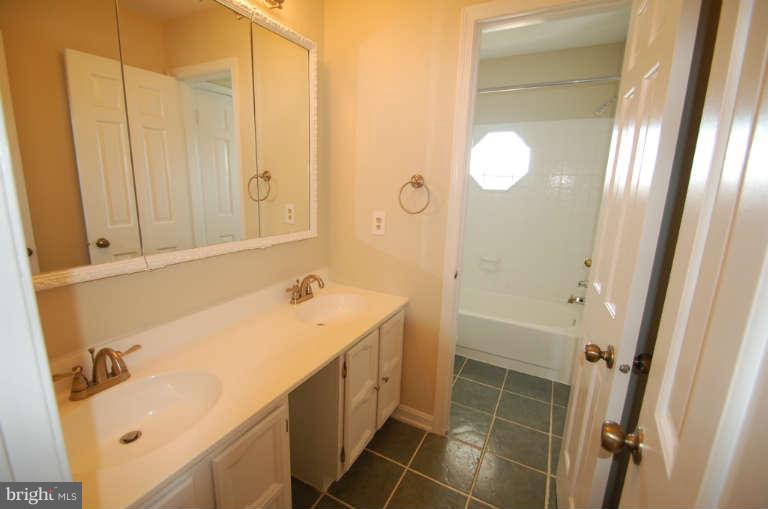 1904 Ednor Road Silver Spring, MD 20905 - Photo 19 of 30 a bathroom with a sink and a mirror