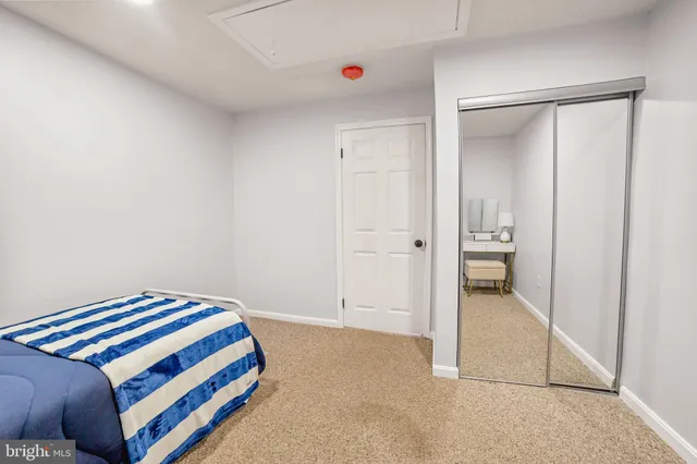 a bedroom with a bed and a cabinet