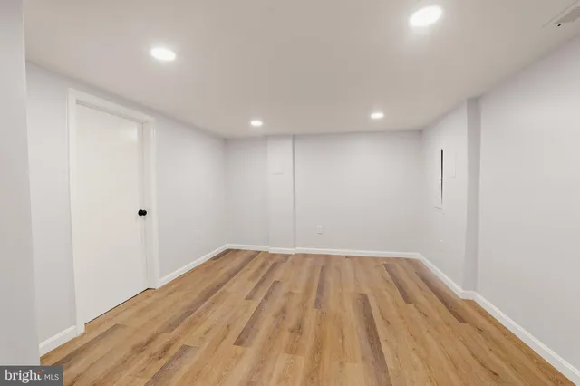 a view of room with wooden floor