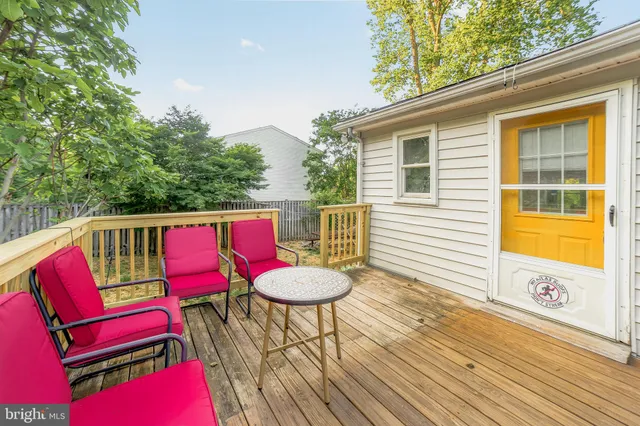 a view of a deck with a table and chairs and wooden floor