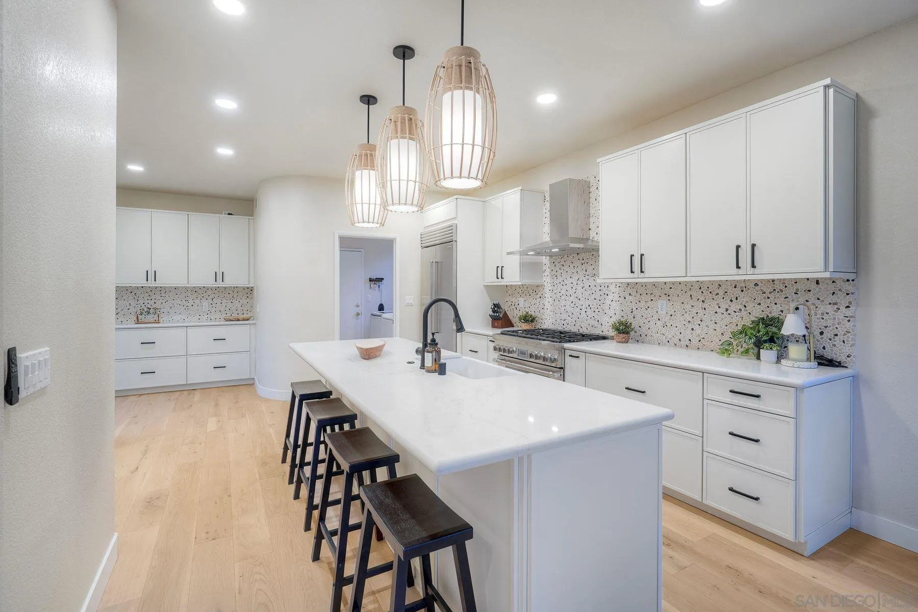 529 Peach Tree Way San Marcos, CA 92069 - Photo 8 of 30 a kitchen with a sink white cabinets and stainless steel appliances