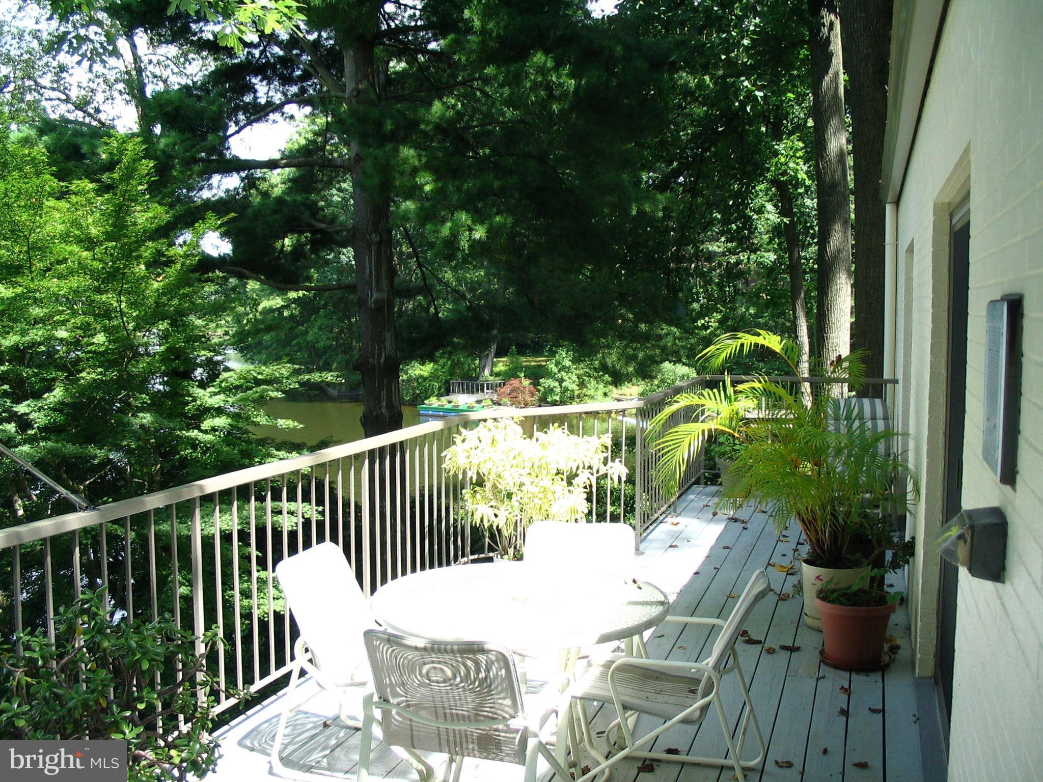 11312 South Shore Road Reston, VA 20190 - Photo 14 of 30 a view of balcony with furniture and garden