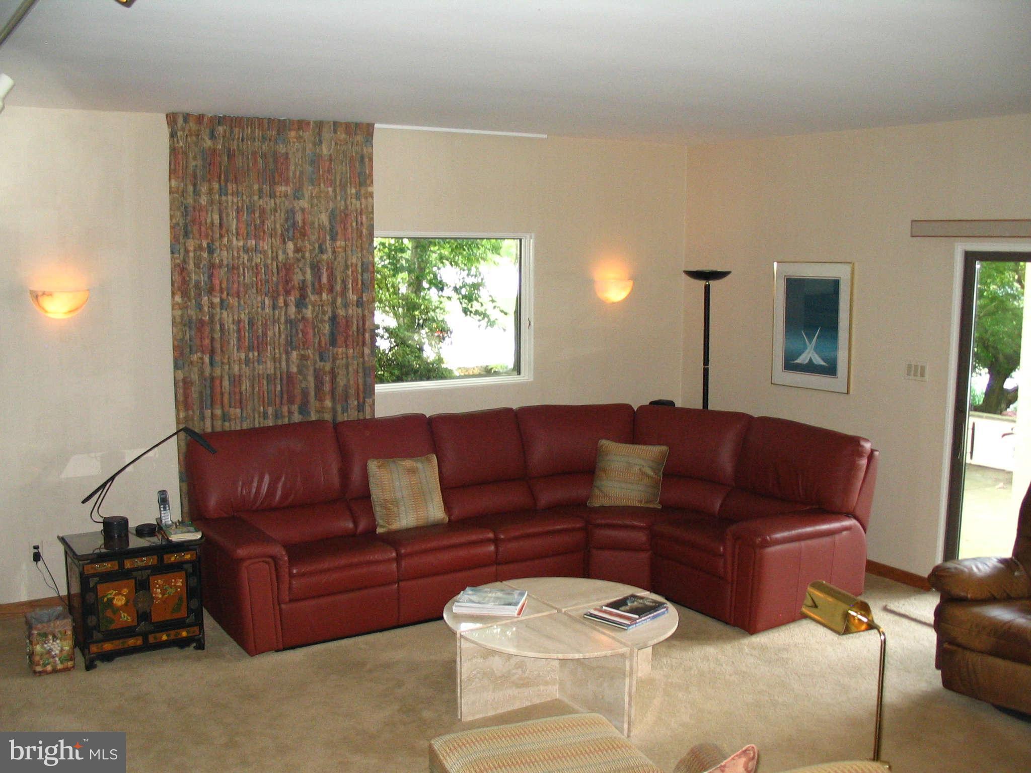 11312 South Shore Road Reston, VA 20190 - Photo 16 of 30 a living room with furniture and a large window