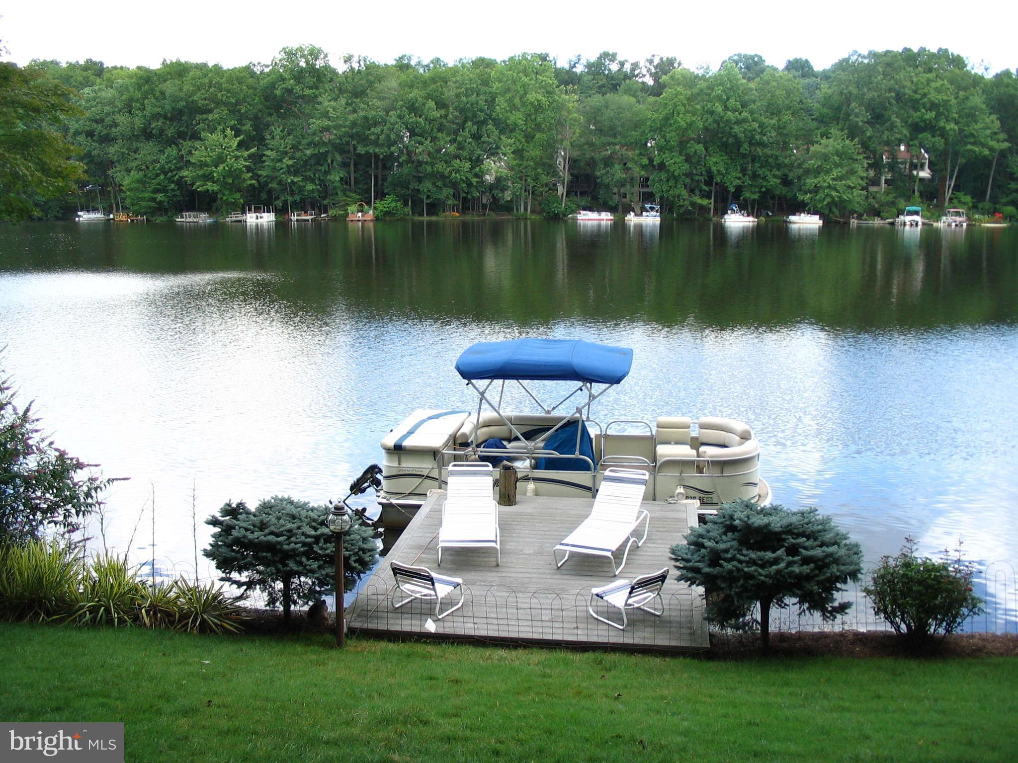 11312 South Shore Road Reston, VA 20190 - Photo 21 of 30 a view of a lake with a yard and trees