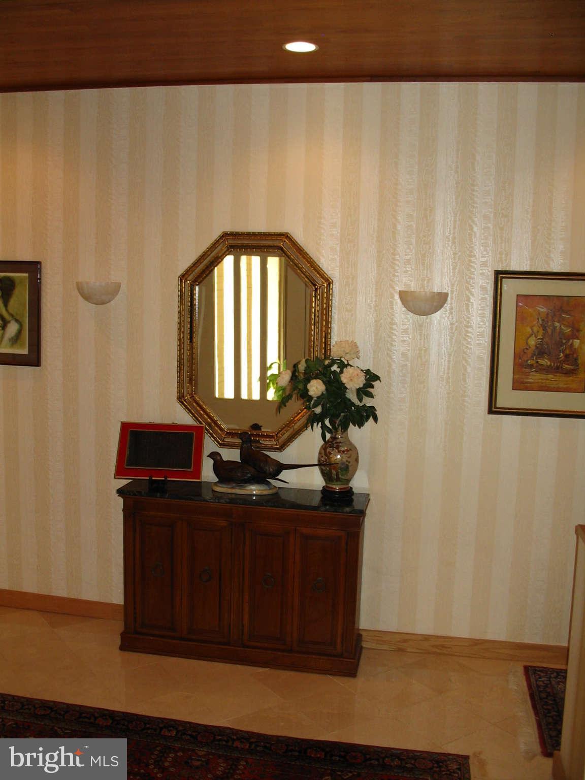 11312 South Shore Road Reston, VA 20190 - Photo 5 of 30 a room with a table and a mirror