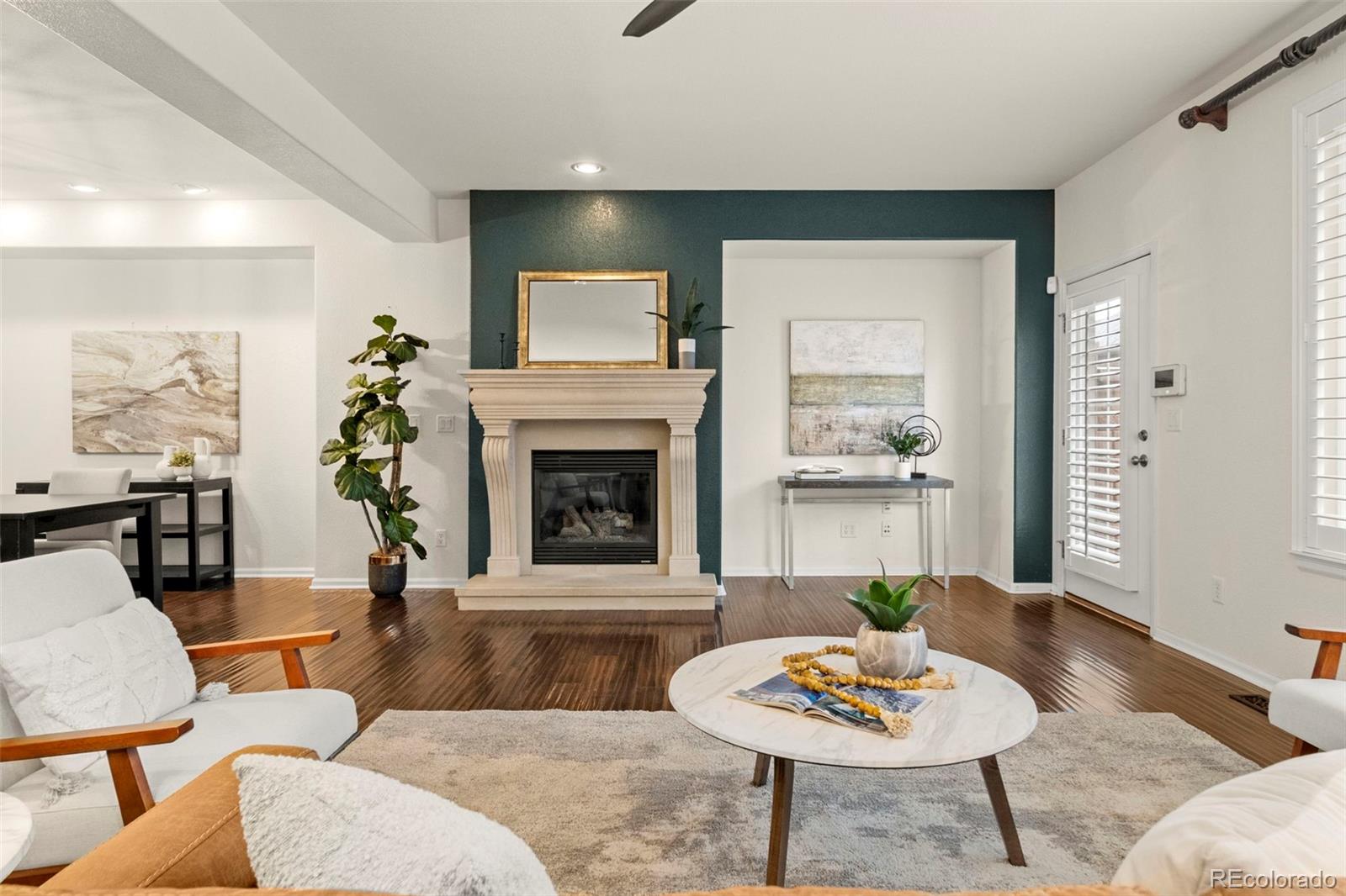 592 Brookhurst Avenue, Unit 26C Highlands Ranch, CO 80129 - Photo 12 of 30 a living room with furniture and a fireplace