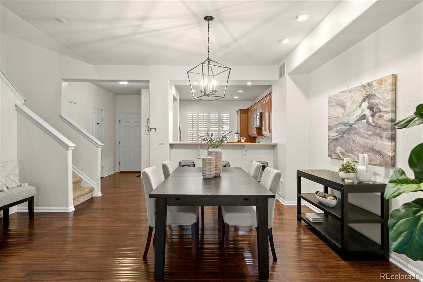 592 Brookhurst Avenue, Unit 26C Highlands Ranch, CO 80129 - Photo 14 of 30 a view of a a dining room with furniture window and wooden floor